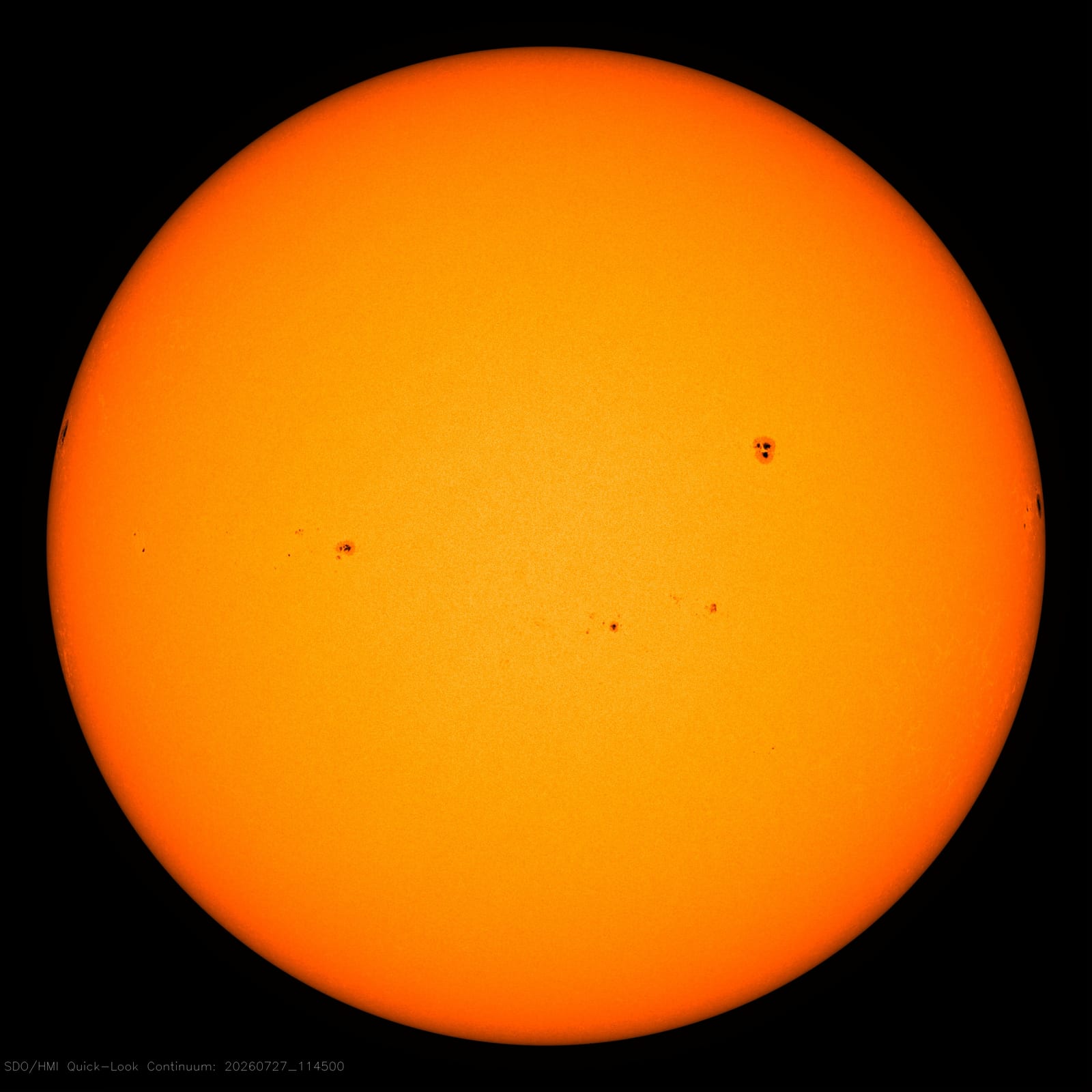 The Sun in visible light captured by the Helioseismic and Magnetic Imager on NASA's Solar Dynamics Observatory. Dark sunspot regions mark concentrated areas of intense magnetic activity on the solar surface. Credit: NASA/SDO.